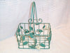 Green metal basket with white flowers